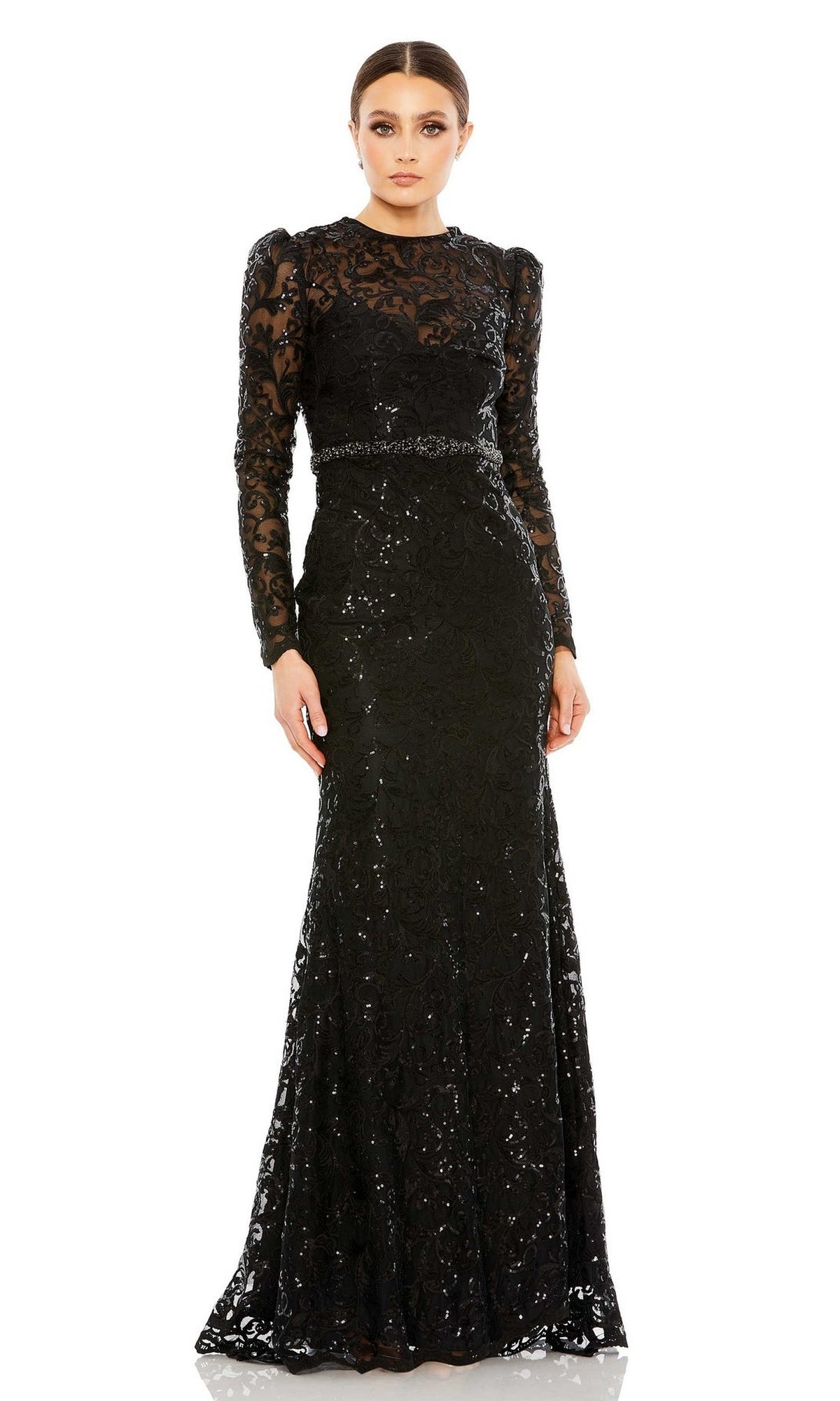 A woman wears the Long Beaded-Lace Formal Dress: Mac Duggal 68011, featuring long sleeves and intricate floral patterns—an elegant evening gown ideal for the mother of the bride.